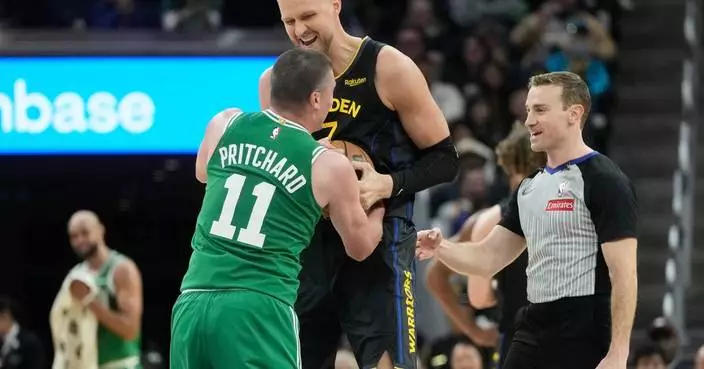 Brown helps Celtics thump Curry-less Warriors 121-110