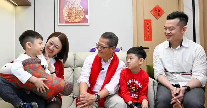 Hong Kong Officials Spread New Year Cheer with Household Visits Across 18 Districts