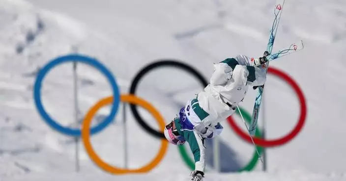 Cooper Woods upsets Mikael Kingsbury for Olympic gold in men’s moguls in a tiebreaker