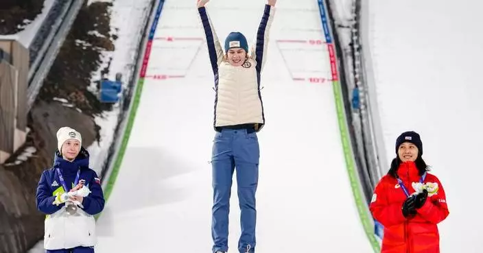 Anna Odine Stroem of Norway hoped for silver and ended up with gold in Olympic ski jumping