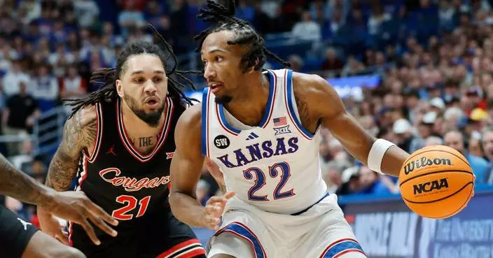 White scores 23 as No. 14 Kansas rebounds with 69-56 win over No. 5 Houston