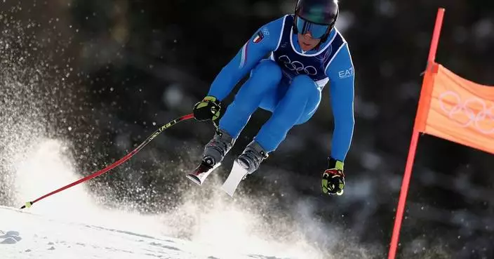 Italian skiers lead men's downhill training at the Olympics as an Austrian crashes
