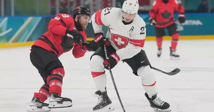 Switzerland forward Kevin Fiala taken off ice at Olympics on stretcher with leg injury