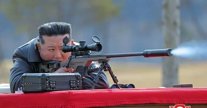North Korea’s Kim gifts rifles to officials and his daughter takes aim after party congress