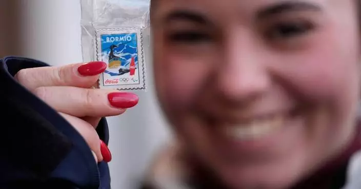 Olympic pin mania has collectors running between landmarks and swarming a trading center