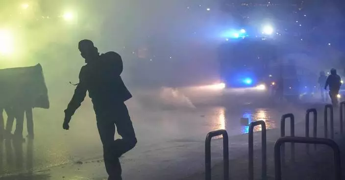 Italian police fire tear gas as protesters clash near Winter Olympics hockey venue