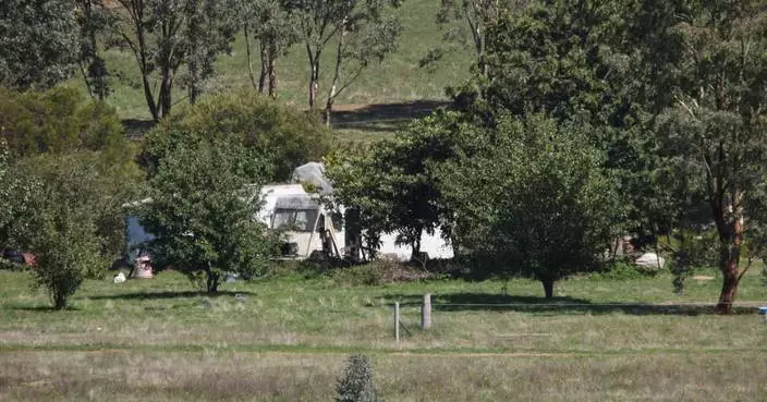Australian police fatally shoot a suspect in a 3-hour standoff after 2 officers killed