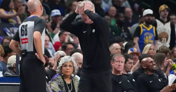 Moses Moody of the Warriors is carted off after apparent knee injury late in OT against Mavs