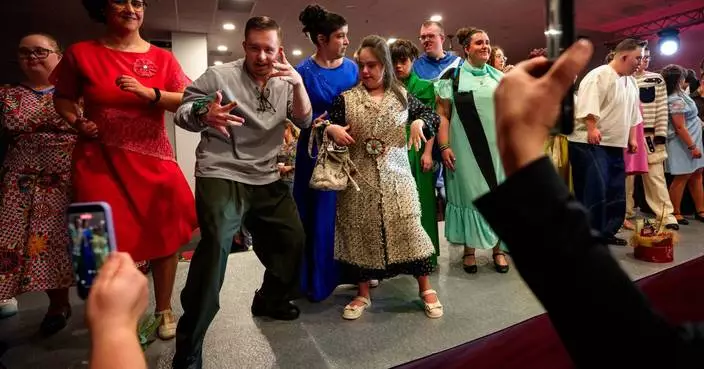 Models with Down syndrome in Romania strike a pose for World Down Syndrome Day