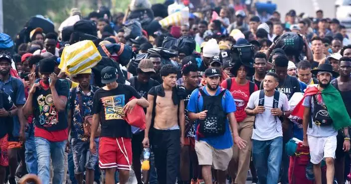Migrants march from southern Mexico, protesting delays and seeking papers to work