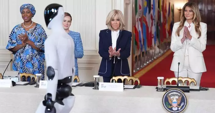 Melania Trump shares the spotlight with a robot at an education and technology event