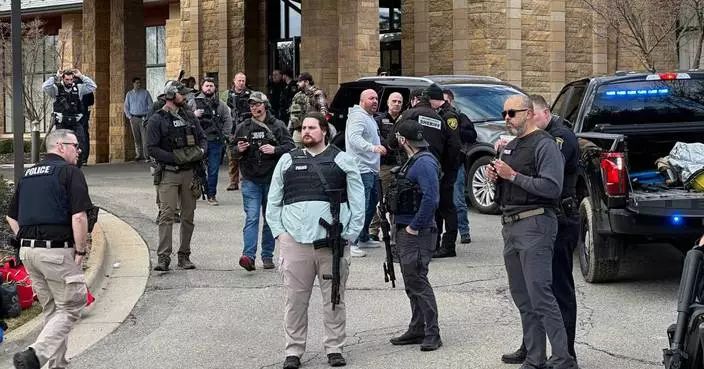 The Latest:  Man fatally shot attacking Michigan synagogue, AP source says