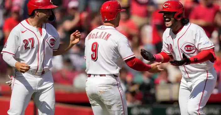 Eugenio Suarez hits a 3-run homer and Reds beat Red Sox 3-2 to win season-opening series