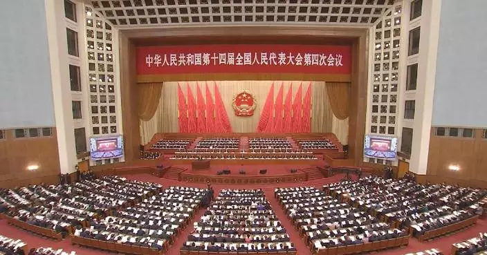 China’s national legislature holds second plenary meeting of annual session to review reports