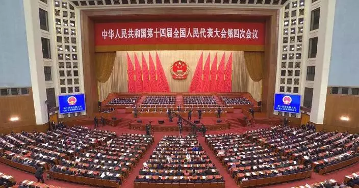 China’s national legislature holds closing meeting of annual session