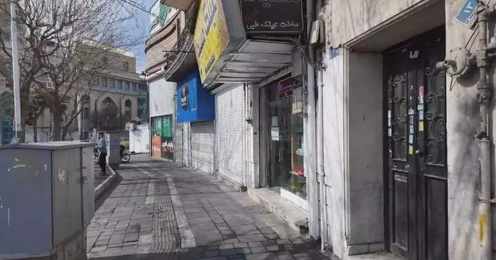 Tehran residents struggle to keep up with daily routine under shadow of air strikes