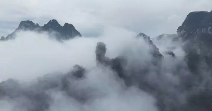 Scenic mountains in central China shrouded by enchanting sea of clouds after rainfall