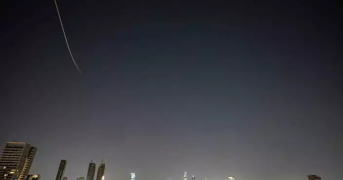 Iran targets Israel and Gulf Arab states even as Trump says US is in talks to end the war