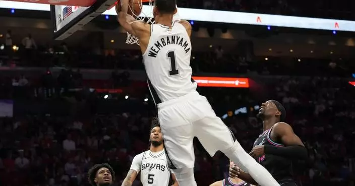 Wembanyama scores 26, red-hot Spurs roll past sliding Heat 136-111