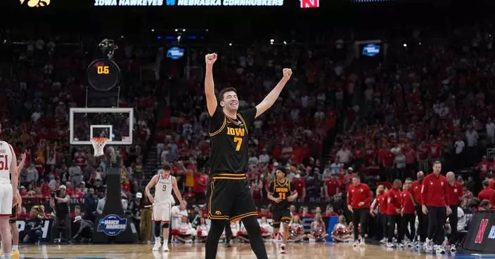 Ninth-seeded Iowa continues improbable March run, beating Nebraska 77-71 to reach Sweet 16