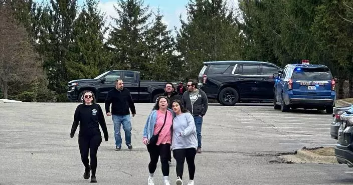 Armed man rammed vehicle into Michigan synagogue and was fatally shot by security, AP source says