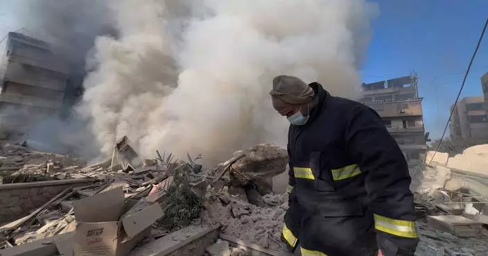 Photos show Lebanese people fleeing and buildings wrecked after Israeli strikes