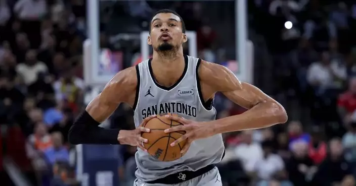 Wembanyama powers Spurs past Clippers 119-115 after wild swings and a late scare to reach 50 wins