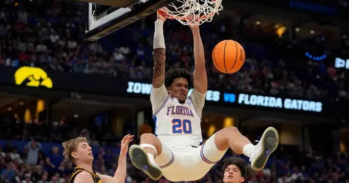 Iowa beats No. 1 seed and defending champ Florida in March Madness on Folgueiras' 3 in final seconds
