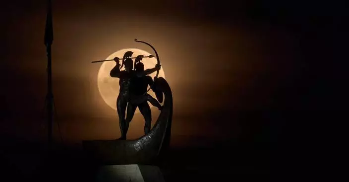 Photos of a blood-red moon and total lunar eclipse