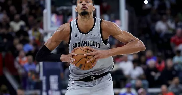 Wembanyama powers Spurs past Clippers 119-115 after wild swings and a late scare to reach 50 wins