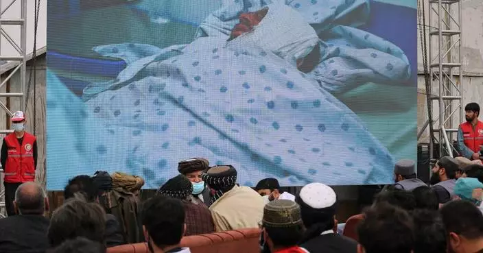 Afghans hold second mass funeral for victims of an airstrike that hit a Kabul drug treatment center