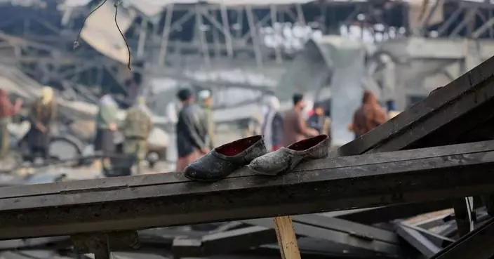 Rescue crews race through rubble after a deadly Kabul airstrike, in photos