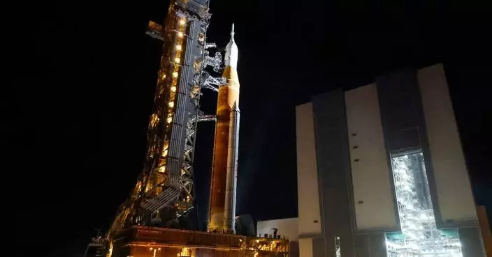 NASA hauls its repaired moon rocket from the hangar back to the pad for an early April launch