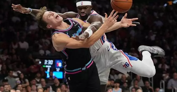 Heat rally late, pull away to beat 76ers