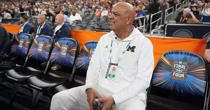 Michigan rolls in hoops and hockey but a football scandal leaves the athletic director on thin ice