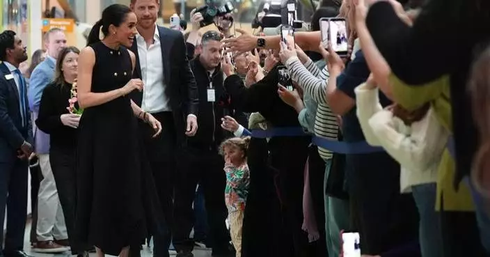 Prince Harry and Meghan arrive in Australia for a low-key, privately funded visit