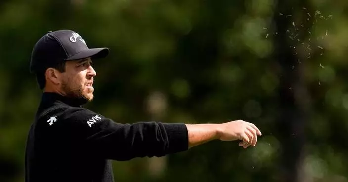 Schauffele's drive appears to land in a viewer's merchandise bag. It didn't stop him from making par