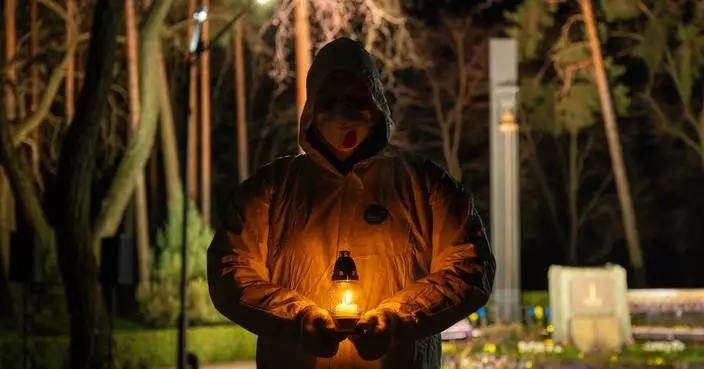 Despite Russia’s war, one Ukrainian city still gathers for midnight Chernobyl vigil