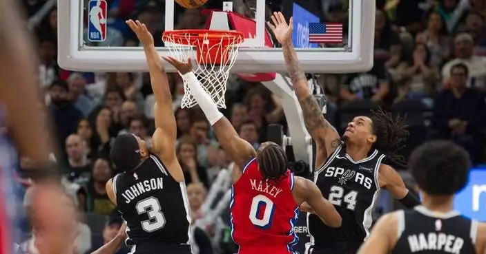 Spurs beat 76ers 115-102 after losing Wembanyama to left rib contusion