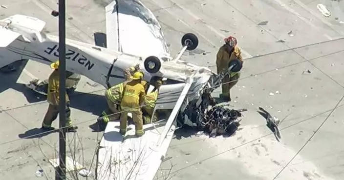 Small plane crashes in parking lot of Los Angeles auto store