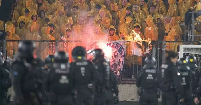 Police chase fans off the field in clashes at German club game in Dresden
