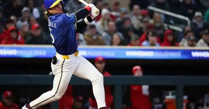 Suárez drives in 2 and Williamson pitches into the 6th as Reds beat Twins 2-1