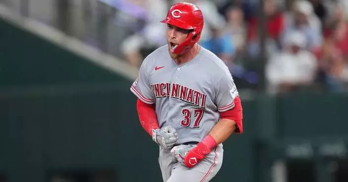 Reds beat Rangers 5-3  in their 1st road game with 3 homers, the last in the 9th