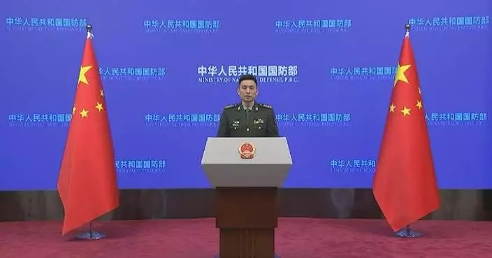 China urges Japan to break away from militarism