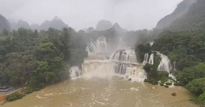 Cross-border waterfall in south China turns golden amid rainy season
