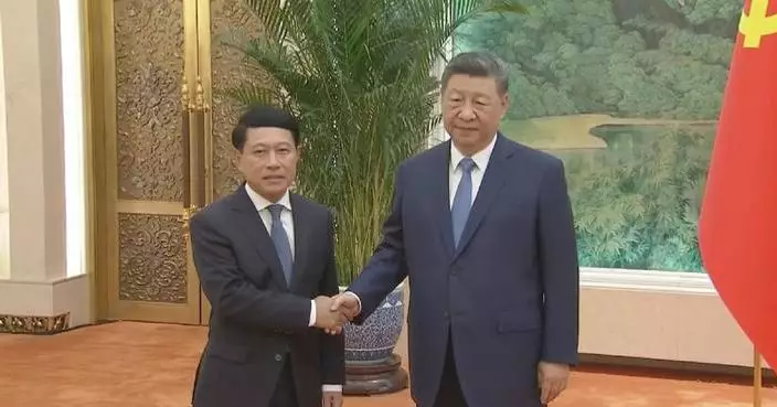 Xi meets special envoy of Lao leader Thongloun