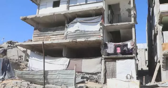 Displaced Palestinians in Gaza forced to shelter in destroyed buildings