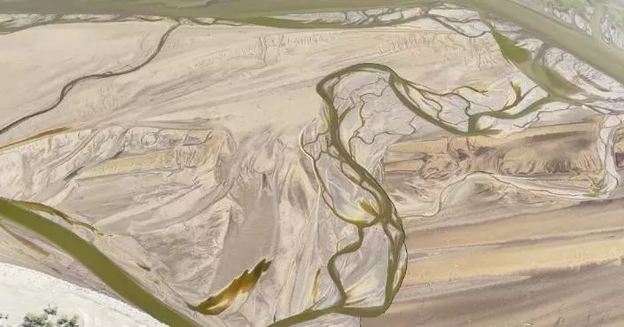 Desert meeting emerald waters at Tarim River source forms unique panorama