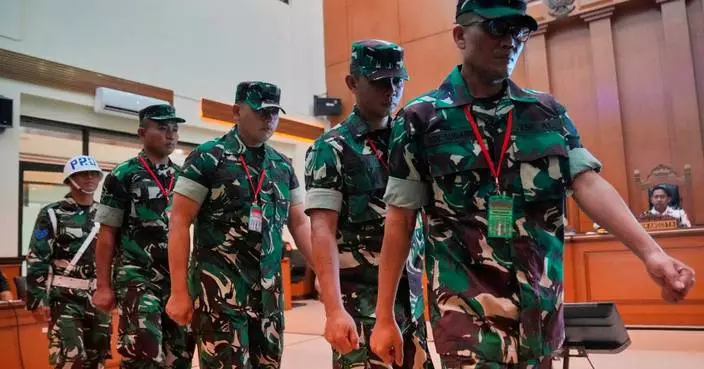 Trial begins for 4 Indonesian service members charged over acid attack on activist