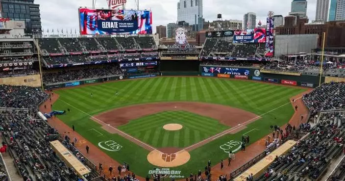 Twins endure a pregame power outage on a cold, rainy day to make for a happy home opener